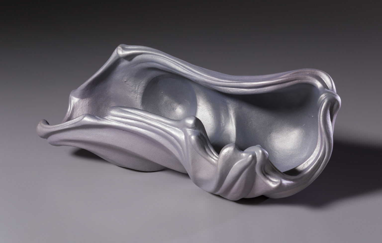 Wave shell by Rosalie Midyette, ceramic and mica, 10x5x4 at Craven Allen Gallery